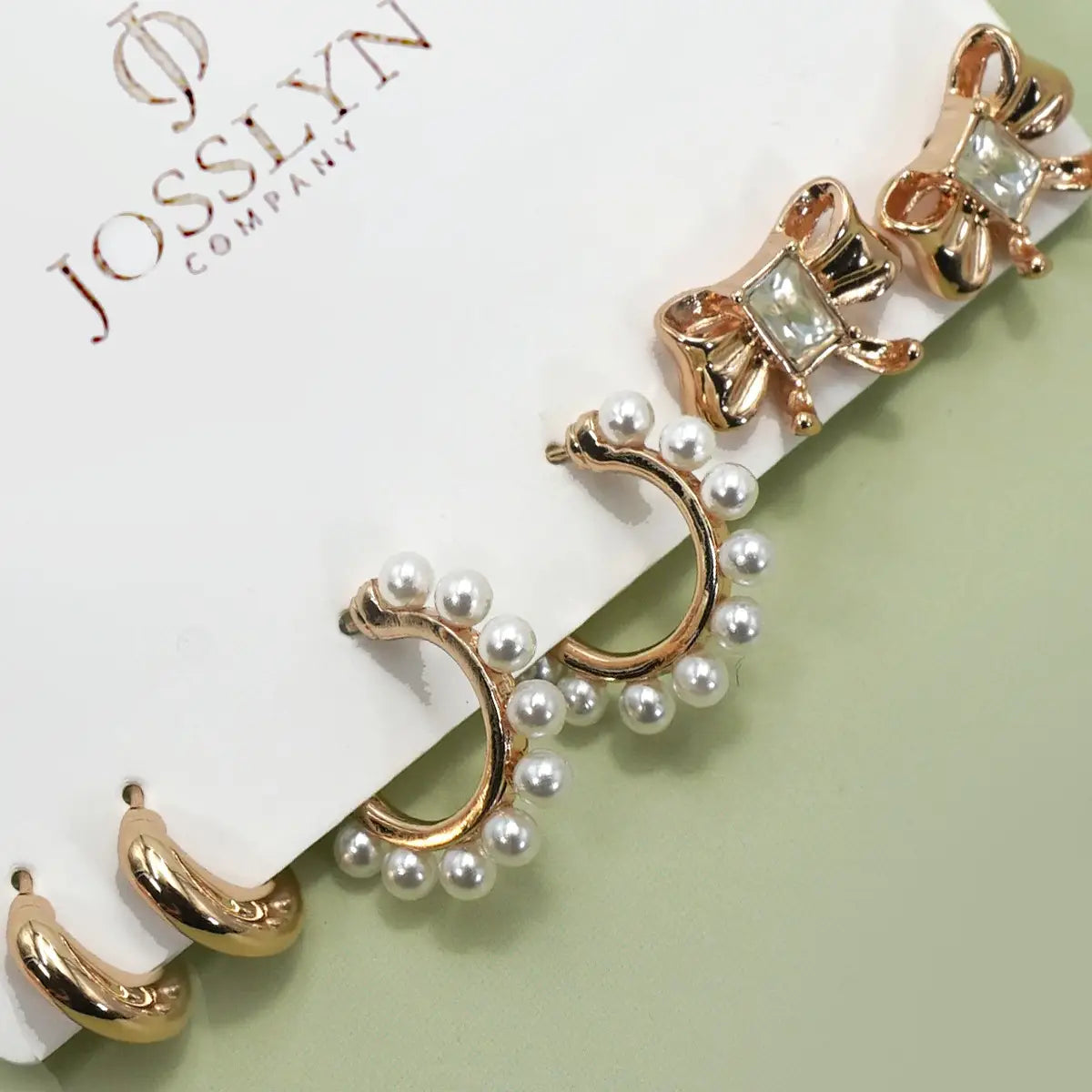 The Trio Pearl Hoops, Bow Studs, and Gold Huggie Earrings