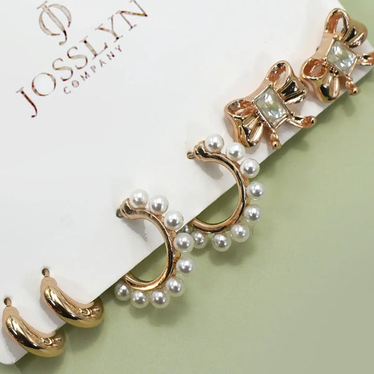 The Trio Pearl Hoops, Bow Studs, and Gold Huggie Earrings